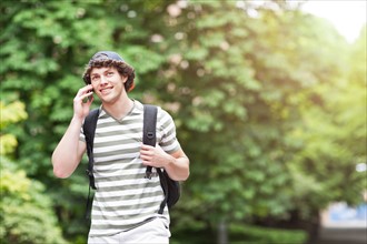 Male college student talking on cell phone. Photo: Take A Pix Media