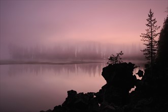 USA, Oregon, Deschutes County, Morning mist on Sparks Lake. Photo: Gary J Weathers