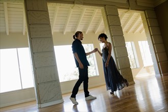 Couple dancing in empty room. Photo: Rob Lewine