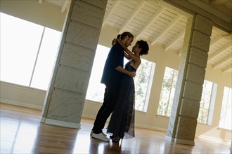 Couple dancing in empty room. Photo : Rob Lewine
