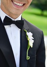 Close-up of smiling groom.