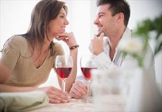 Smiling couple drinking wine. Photo : Jamie Grill
