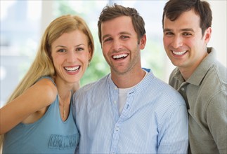 Portrait of group of friends laughing.