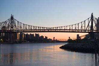USA, New York State, New York City, Manhattan, Queensboro bridge at dusk. Photo: fotog
