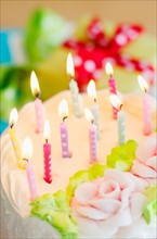 Close-up of birthday candles on cake.
