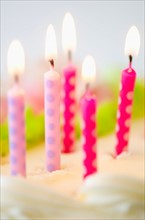 Close-up of birthday candles on cake.