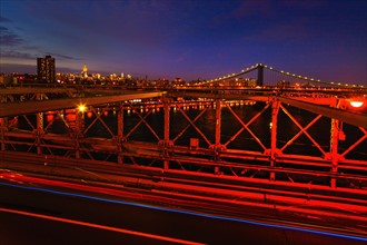 USA, New York State, New York City, Midtown Manhattan and Brooklyn Bridge at dusk.