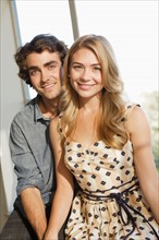 Portrait of young couple at home. Photo: Rob Lewine