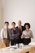 Portrait of business team in board room. Photo : Rob Lewine