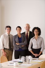 Portrait of business team in board room. Photo : Rob Lewine