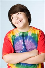 Studio portrait of boy (10-11) in colorful shirt. Photo : Rob Lewine
