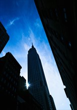 USA, New York City, Empire State Building with solar flare.