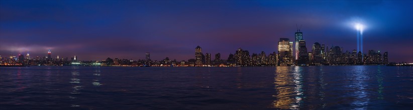 Panorama of New York at night with tribute in light.