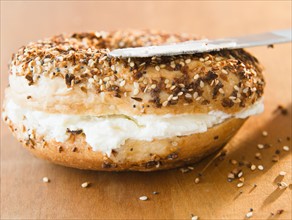Close up of bagel with cream cheese. Photo : Jamie Grill