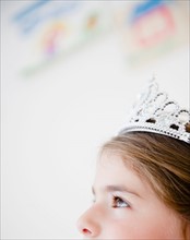 Close up of girl's head ( 6-7) with crown. Photo : Jamie Grill