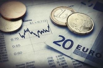 Euro currency with financial graph, studio shot.
