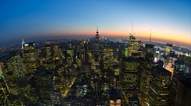 USA, New York City, Manhattan skyline at dusk.