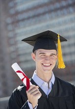Teenage boy (16-17) at his graduation ceremony.