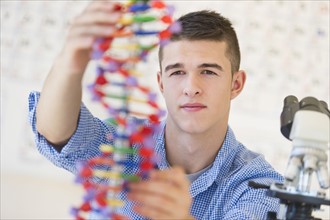 Teenage student (16-17) learning genetics.