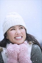 Portrait of happy woman wearing warm clothing.