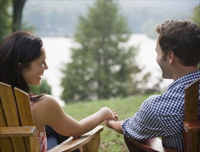 Roaring Brook Lake,  Close up of couple relaxing by lake. Photo: Jamie Grill