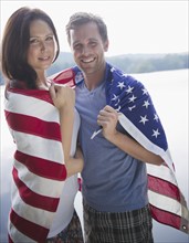 Roaring Brook Lake, Couple wrapped in American flag. Photo: Jamie Grill