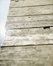 Roaring Brook Lake, Close up of wooden pier. Photo : Jamie Grill
