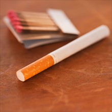 Close up of cigarette and matches. Photo : Daniel Grill