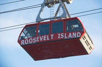 USA, New York City, Low angle view of Roosevelt Island Tram gondola. Photo: fotog