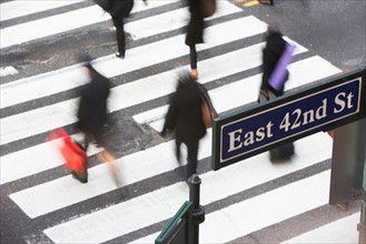 USA, New York City, Manhattan, 42nd street, Pedestrians on zebra crossing. Photo: fotog