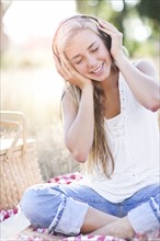 Teenage girl (16-17) posing with headphones on. Photo : Take A Pix Media
