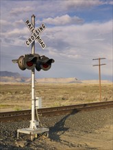 USA, Utah, Desert landscape with railroad crossing. Photo : John Kelly