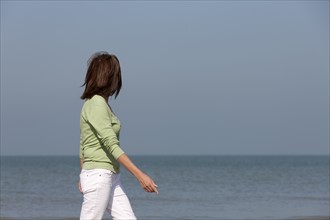 Woman on beach. Photo: Jan Scherders