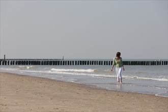 Woman on beach. Photo : Jan Scherders