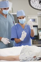 Surgeons preparing patient for surgery. Photo: db2stock