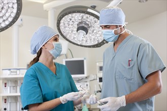 Surgeons in operating room. Photo : db2stock