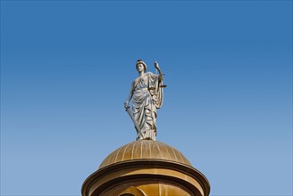 USA, Texas, San Marcos, Statue of Justice on top of copper dome of 1908 Hays County Courthouse.