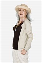 Studio portrait of mature woman wearing hat. Photo: Rob Lewine