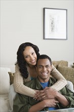 Portrait of couple at home. Photo : Rob Lewine