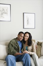Portrait of couple at home. Photo : Rob Lewine