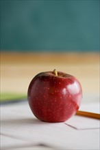 Red apple on teacher's desk. Photo: Rob Lewine