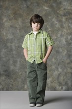 Portrait of boy (6-7), studio shot. Photo : Rob Lewine
