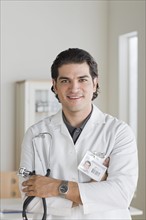 Portrait of smiling male doctor. Photo: Rob Lewine