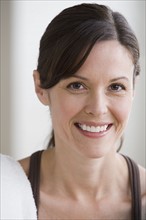 Portrait of woman smiling. Photo : Rob Lewine