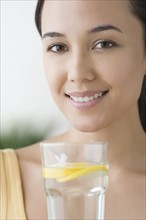 Attractive woman with glass of water. Photo : Rob Lewine