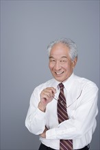 Portrait of happy senior businessman. Photo : Rob Lewine