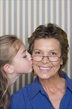 Portrait of girl (8-9) with grandmother. Photo : Rob Lewine