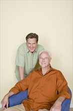 Portrait of senior man with adult son. Photo : Rob Lewine