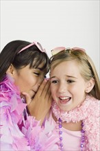 Two girls (10-11) gossiping . Photo : Rob Lewine