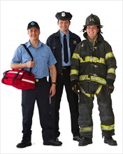 Studio portrait of emergency medical technician, policeman and fireman.